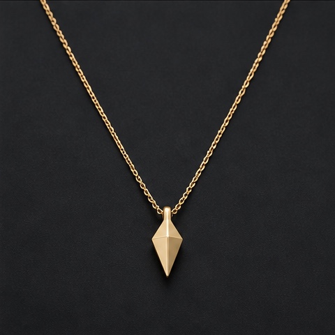 Source product photo of a fine gold chain with a small angular pendant